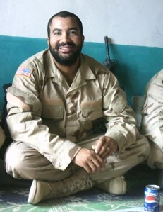 Bearded man in a sterilized uniform with a rifle in the background, what do you think this is? This picture, while published elsewhere, has never been misrepresented. Former grunt turned speaker monkey having lunch with the locals. Not a Special Forces soldier