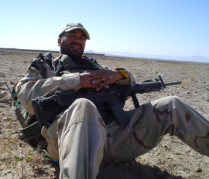 Earned blue cord but reclassed to PSYOP. Here he is on a mission with SF waiting on the Chinooks in 120 degree heat with 75 pounds of gear and bang. Grunt or POG?