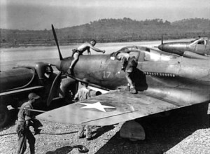 U.S. Army Air Corps crewmen service Bell P-39D Airacobra at Seven Mile airfield, near Port Moresby, New Guinea, in July 1942.