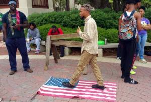 A violation of Flag Code and legally a reason to take the flag and dispose of it properly. This is what prompted Manhart to take the flag.