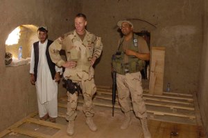 Maj. Wilson inspecting the work he and his troops did. It was so hot gear had to be dropped.
